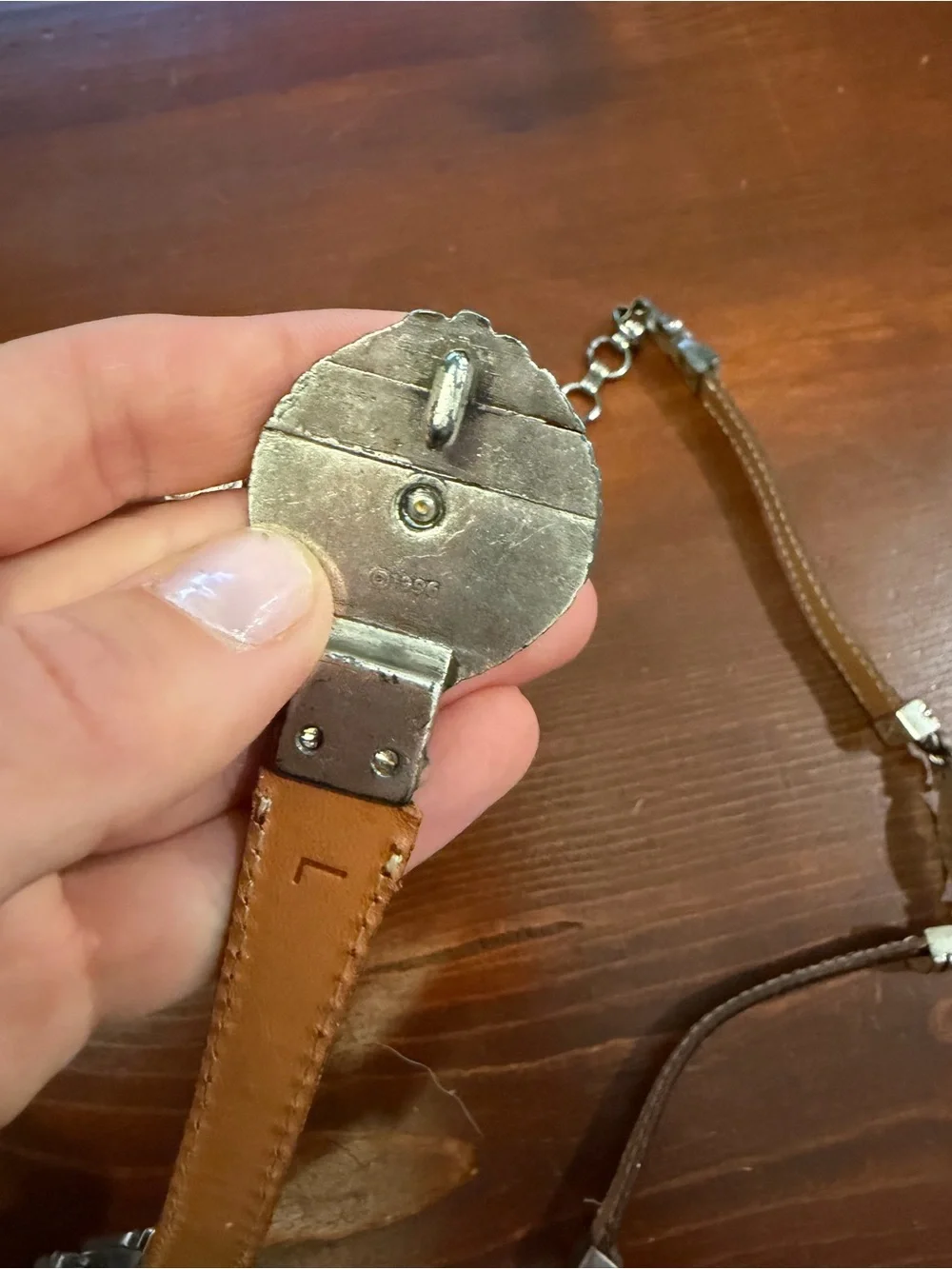 1996 Branded metal and leather accent belt